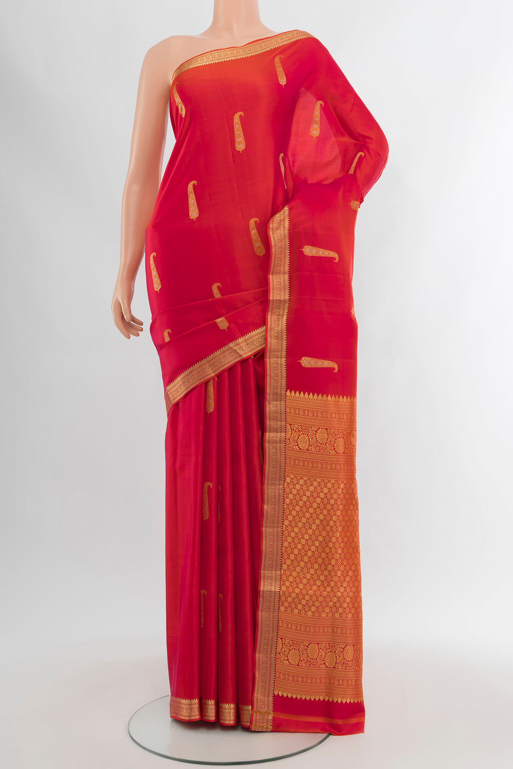 Pink with orange Color Soft Silk Saree with Zari Butta on the body and Zari Border.  displayed on a mannequin