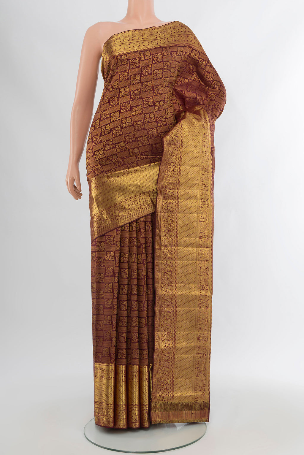 Pure Silk Pure Zari Coffee Brown Kanchipuram Saree with Zari Butta on the body and Silk Border.  displayed on a mannequin