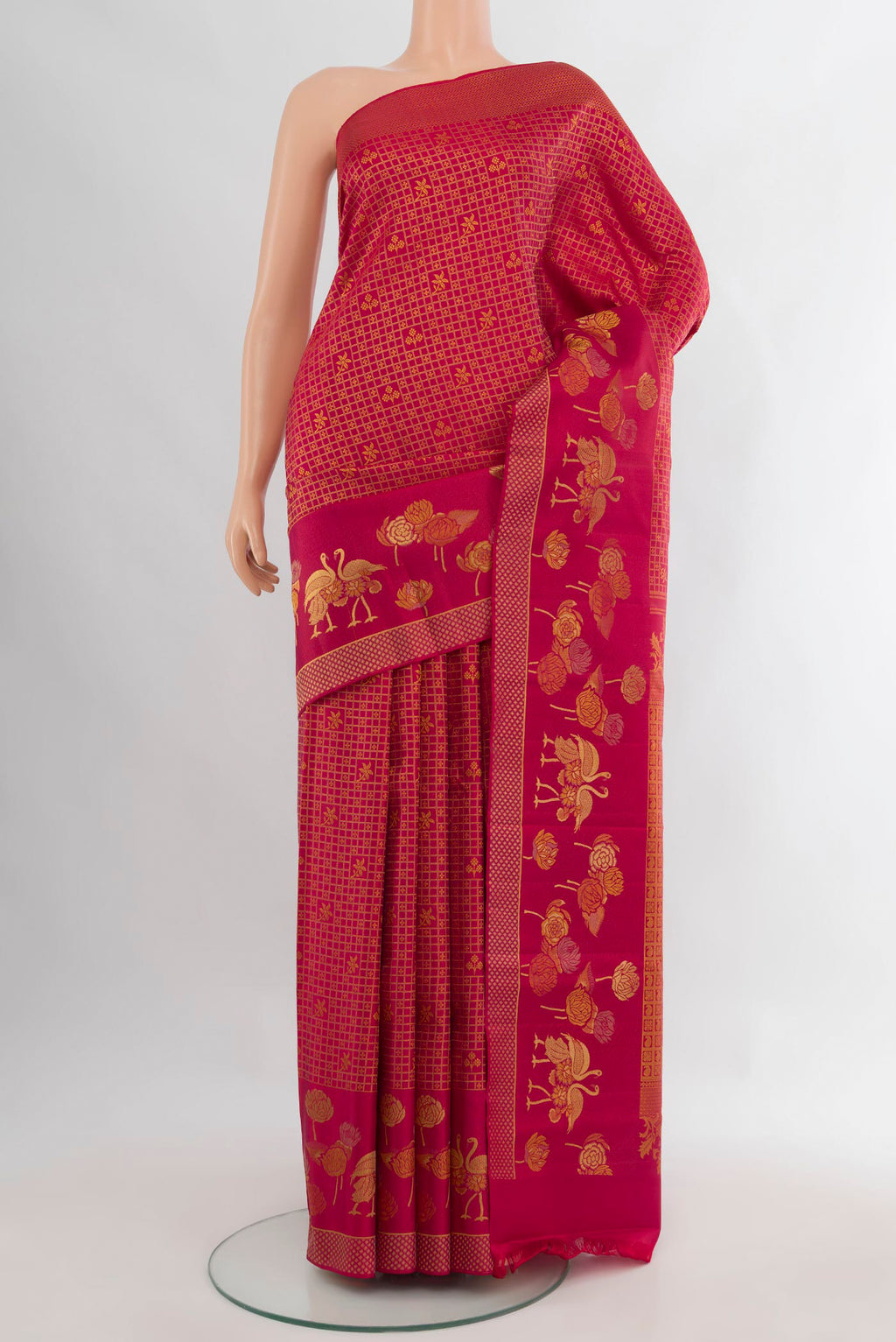 Pure Silk Dark Pink Kanjivaram Saree with Zari Brocade on the body and Zari Border.  displayed on a mannequin