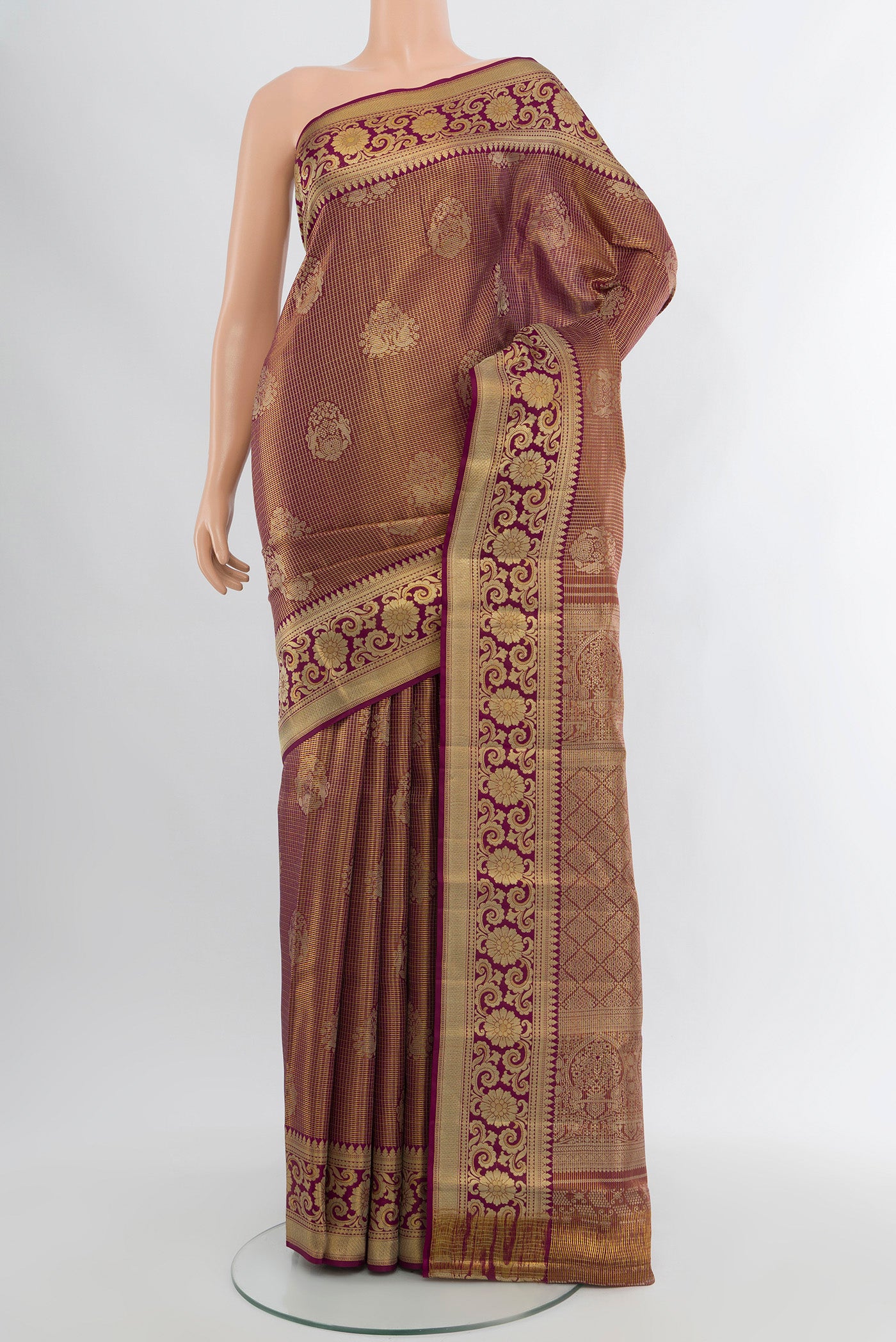Purple Kanjivaram Tissue Silk Saree with Zari Brocade on the body and Zari Border.  displayed on a mannequin