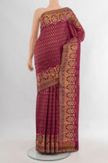 Pure Silk Magenta Kanjivaram Saree with Zari Brocade on the body and Zari Border.  displayed on a mannequin