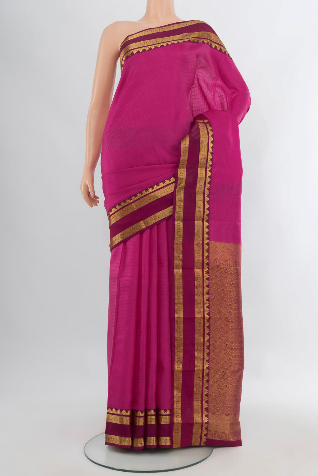 Pink Kanchipuram Silk Saree with Checked design on the body and Zari Border.  displayed on a mannequin