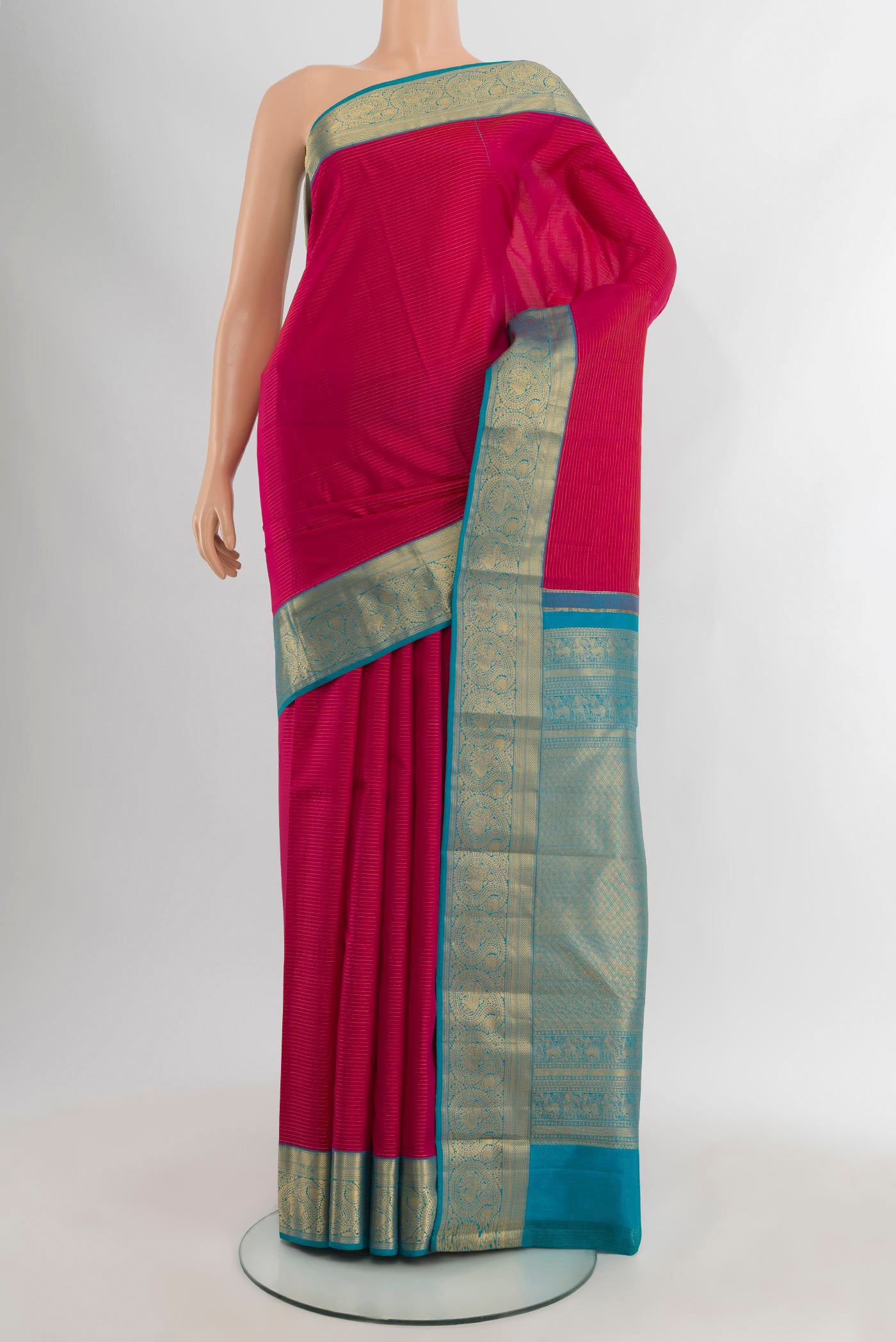 Pink Kanchipuram Silk Saree with Stripes on the body and Zari Border.  displayed on a mannequin