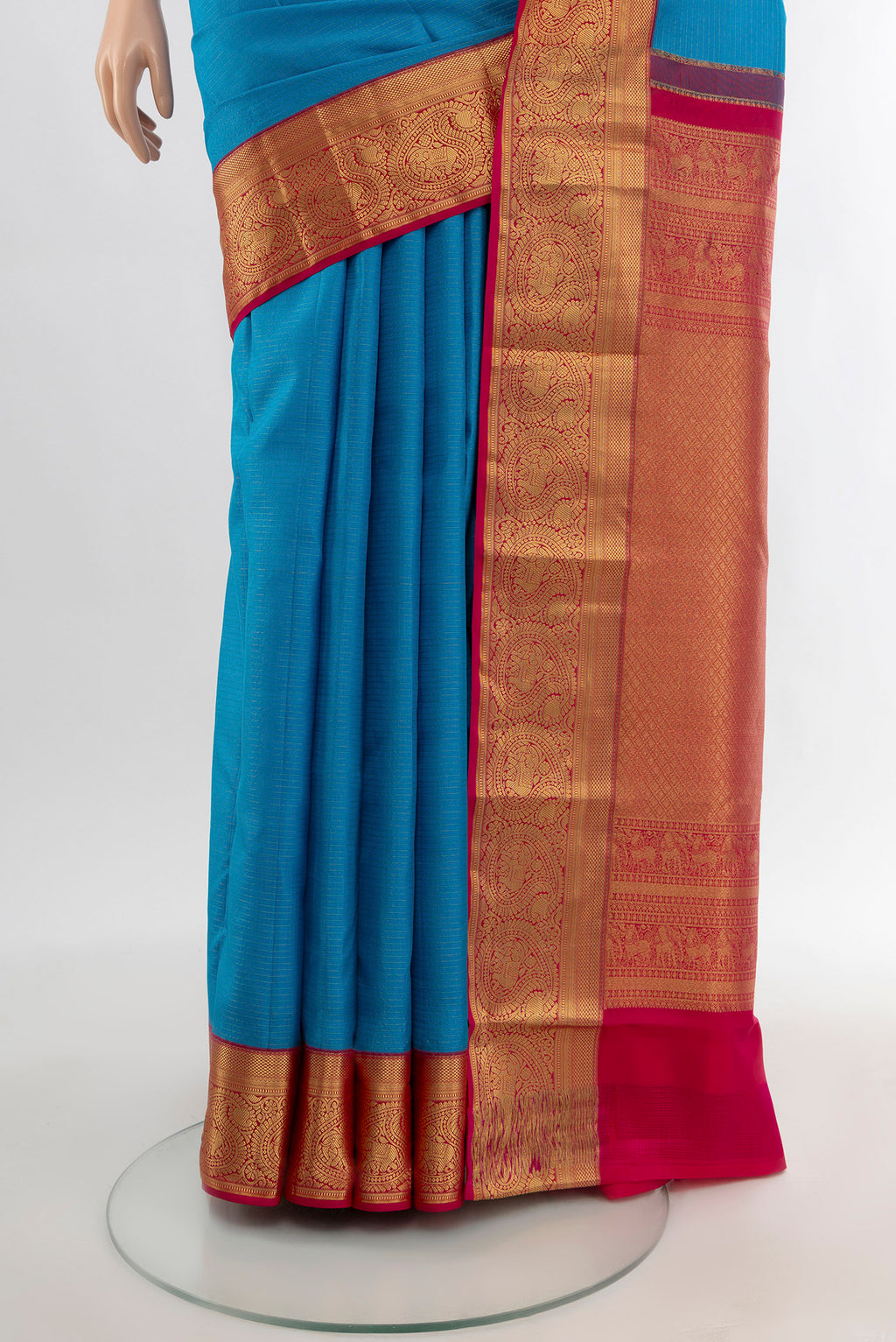 Pleats and pallu of Blue Kanchipuram Silk Saree with Plain Body and Zari Border. 