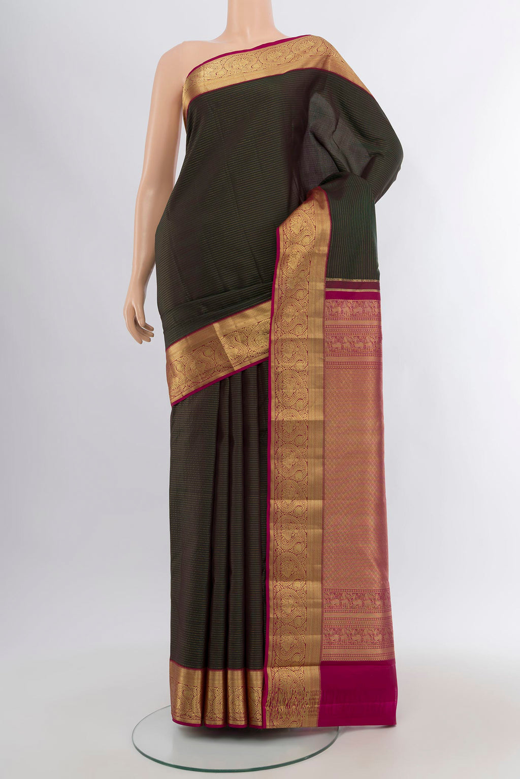 Bottle Green Kanchipuram Silk Saree with Stripes on the body and Zari Border.  displayed on a mannequin