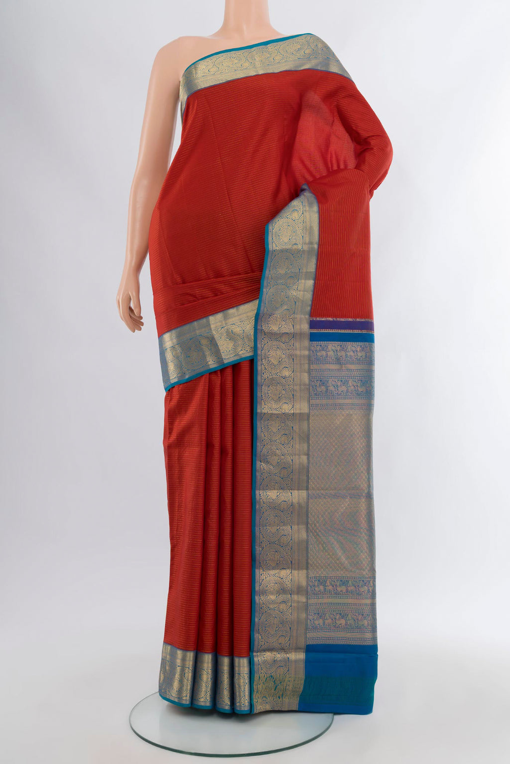 Maroon Kanchipuram Silk Saree with Stripes on the body and Zari Border.  displayed on a mannequin