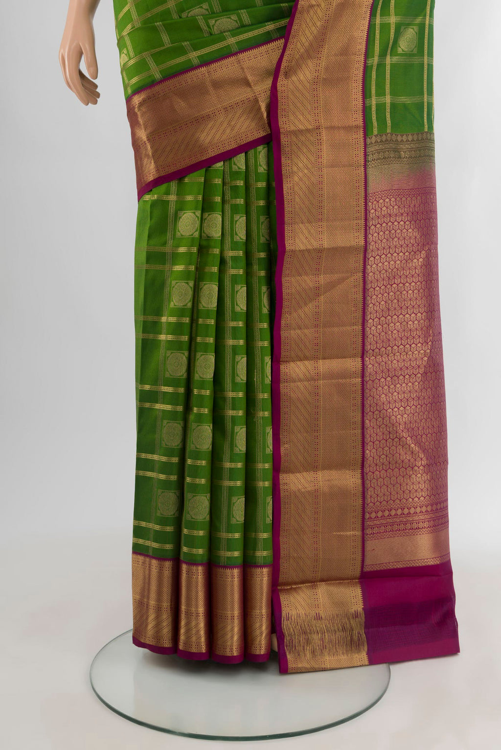 Pleats and pallu of Green Kanchipuram Silk Saree with Checked design on the body and Zari Border. 