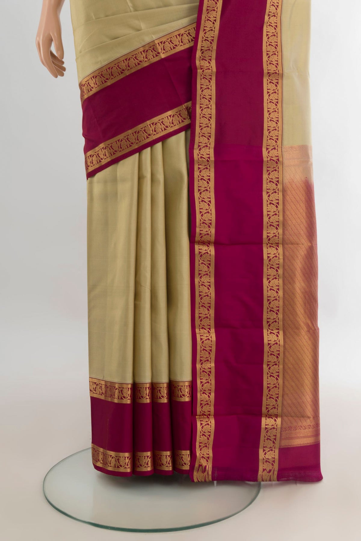 Pleats and pallu of Pure Silk Beige Kanchipuram Saree with Plain Body and Zari Border. 