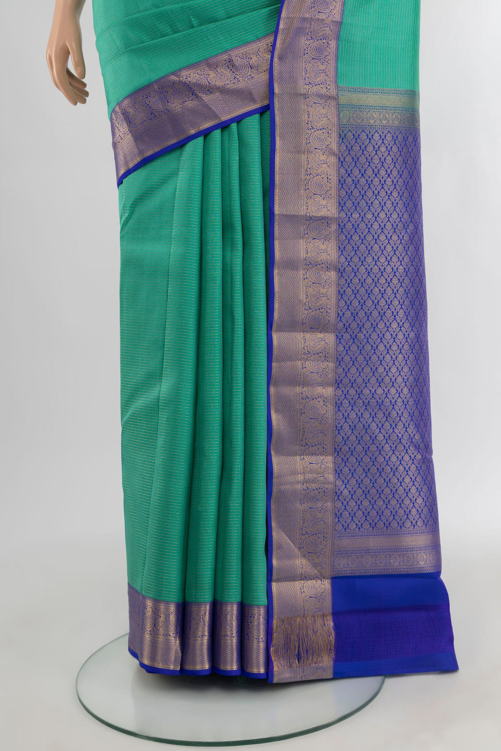 Pleats and pallu of Turquoise Kanchipuram Silk Saree with Zari Butta on the body and Zari Border. 