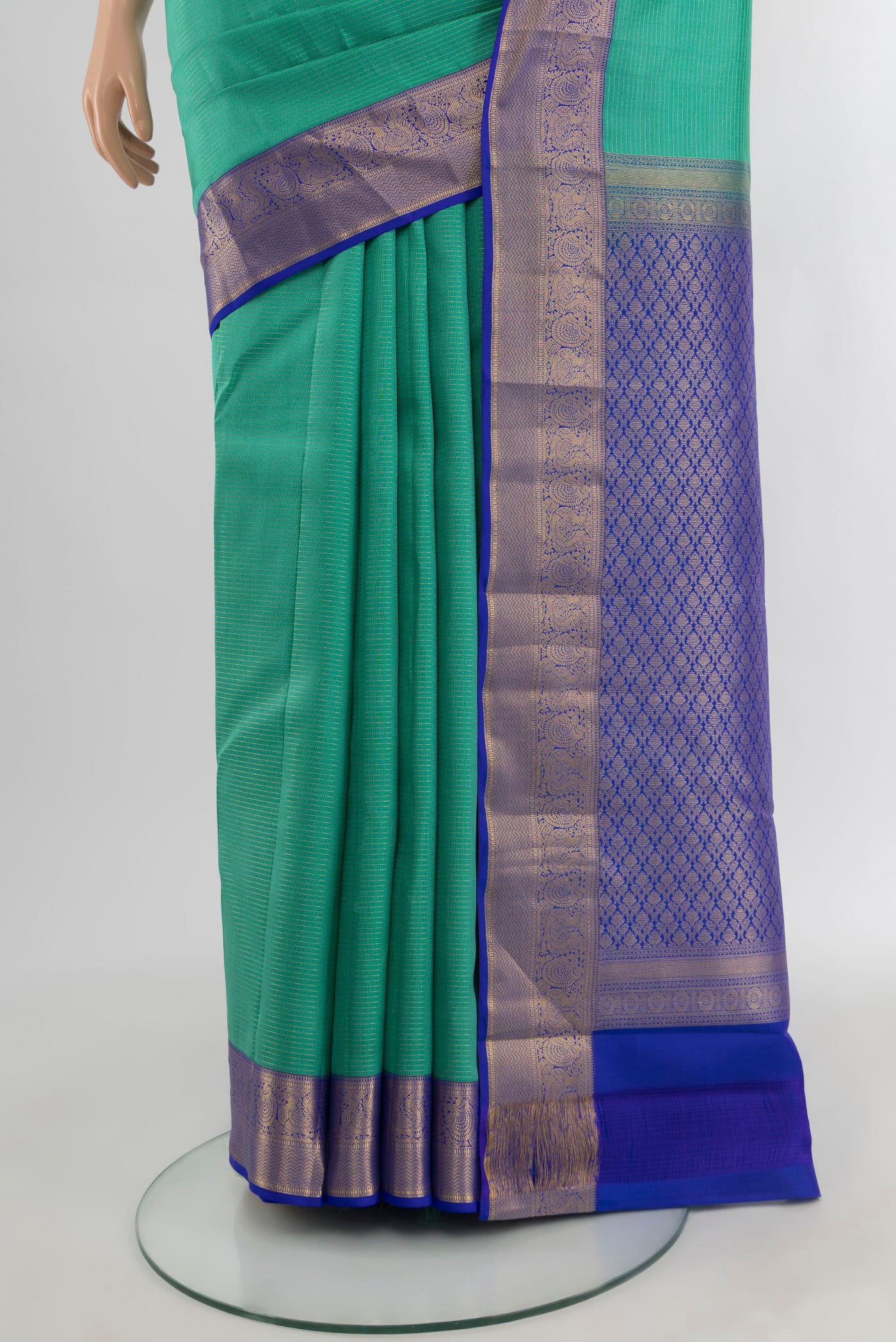 Pleats and pallu of Turquoise Kanchipuram Silk Saree with Zari Butta on the body and Zari Border. 
