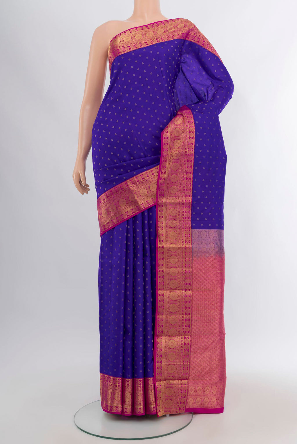 Royal Blue Kanchipuram Silk Saree with Zari Butta on the body and Zari Border.  displayed on a mannequin