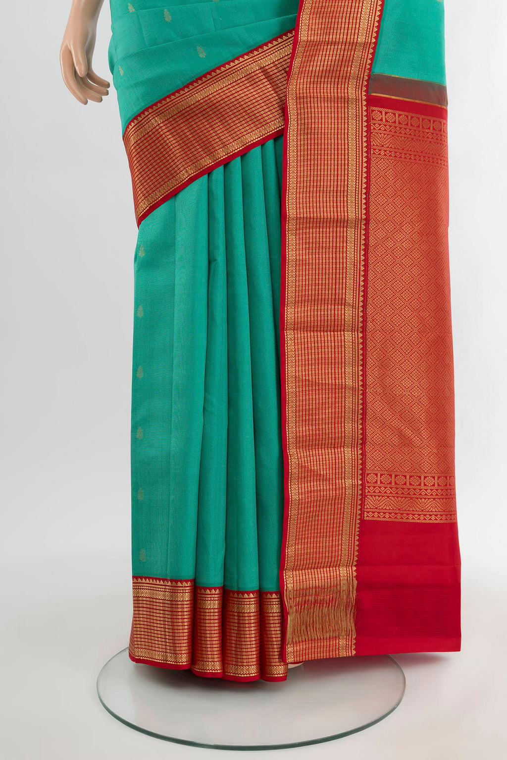 Pleats and pallu of Turquoise Kanchipuram Silk Saree with Zari Butta on the body and Zari Border. 