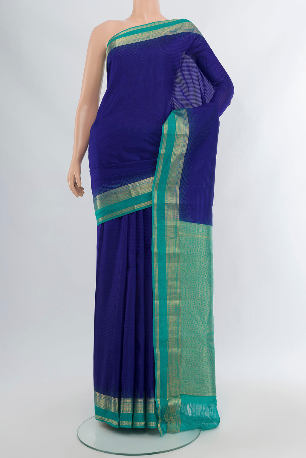 Dark Blue Kanchipuram Silk Saree with Stripes on the body and Zari Border.  displayed on a mannequin