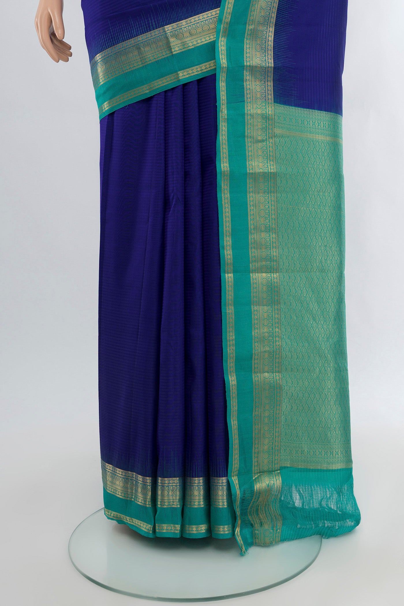 Pleats and pallu of Dark Blue Kanchipuram Silk Saree with Stripes on the body and Zari Border. 
