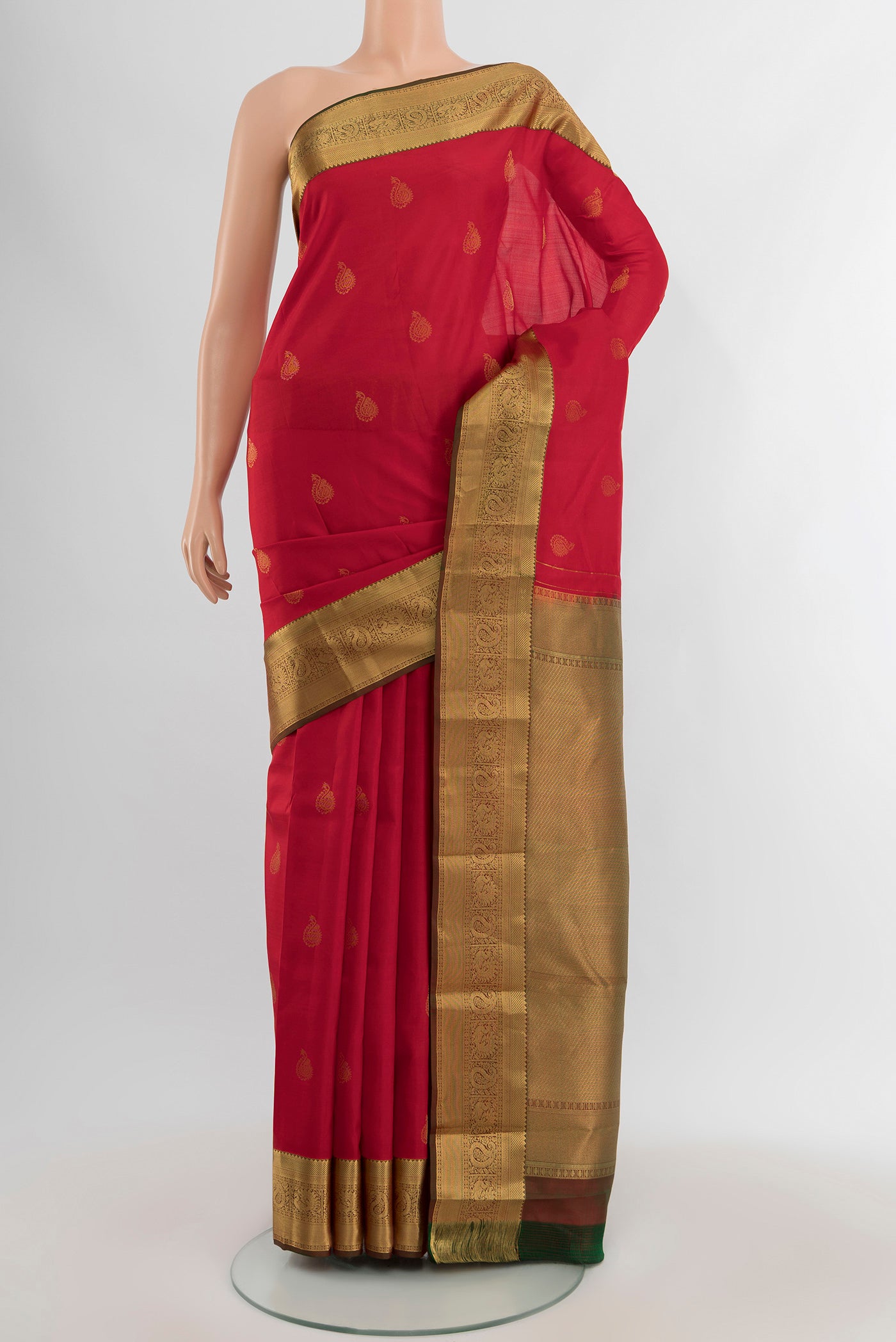 Red Kanchipuram Silk Saree with Zari Butta on the body and Zari Border.  displayed on a mannequin