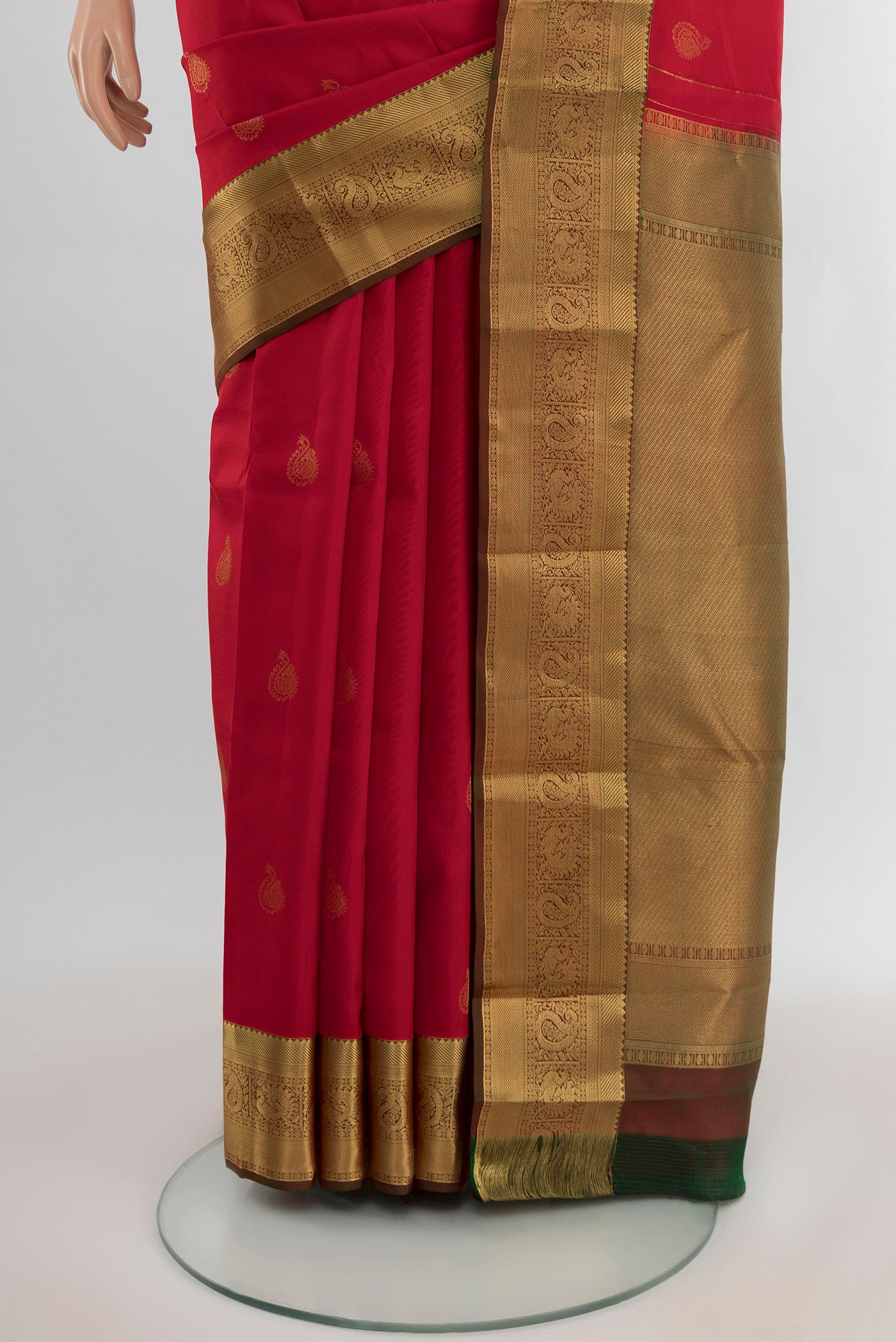 Pleats and pallu of Red Kanchipuram Silk Saree with Zari Butta on the body and Zari Border. 