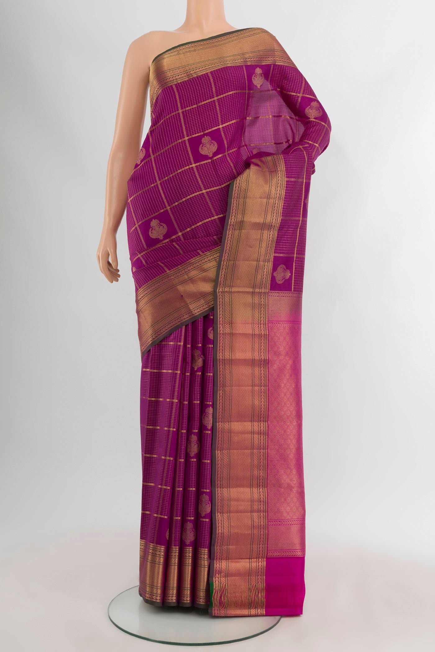 Purple Kanchipuram Silk Saree with Zari Butta on the body and Zari Border.  displayed on a mannequin