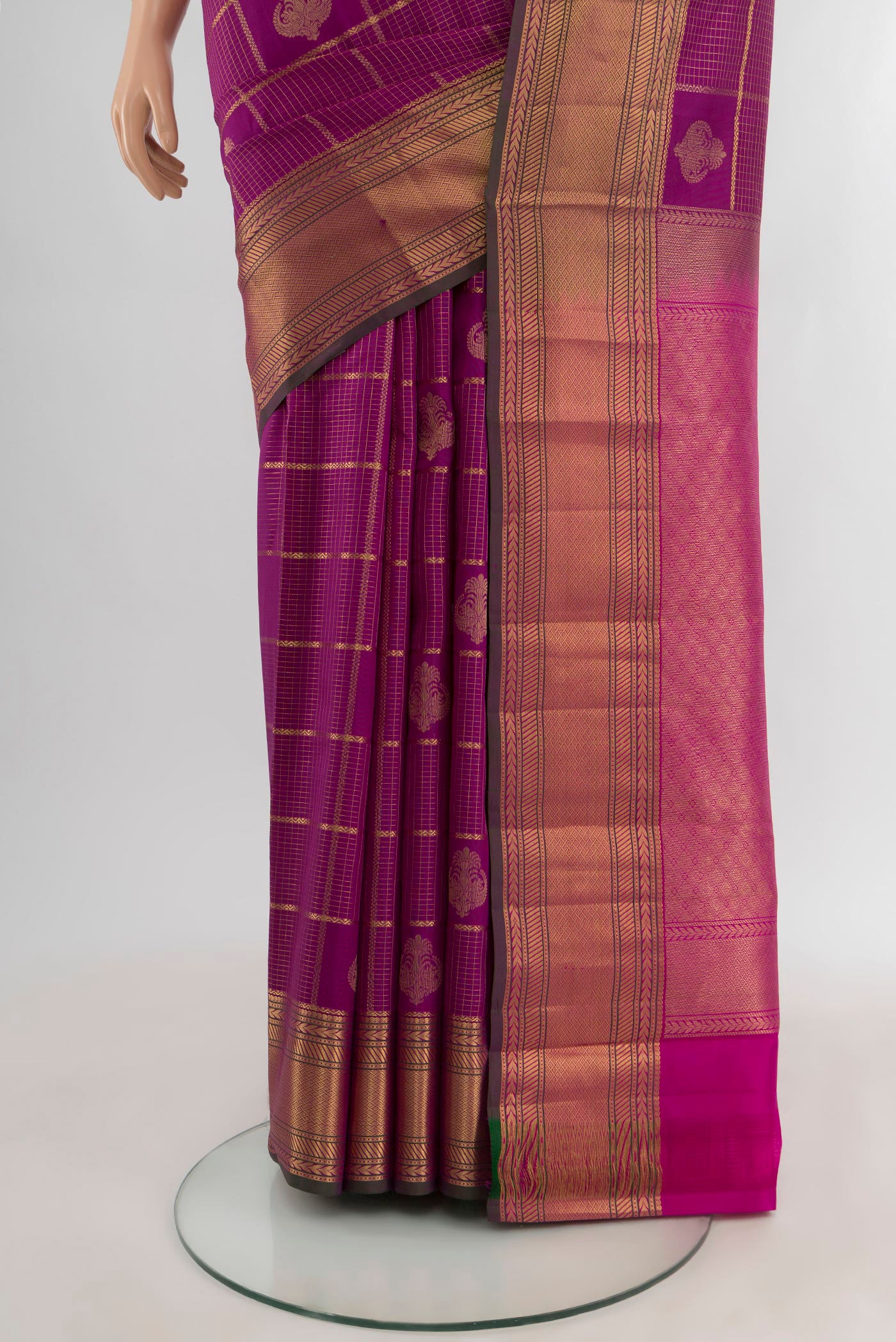 Pleats and pallu of Purple Kanchipuram Silk Saree with Zari Butta on the body and Zari Border. 