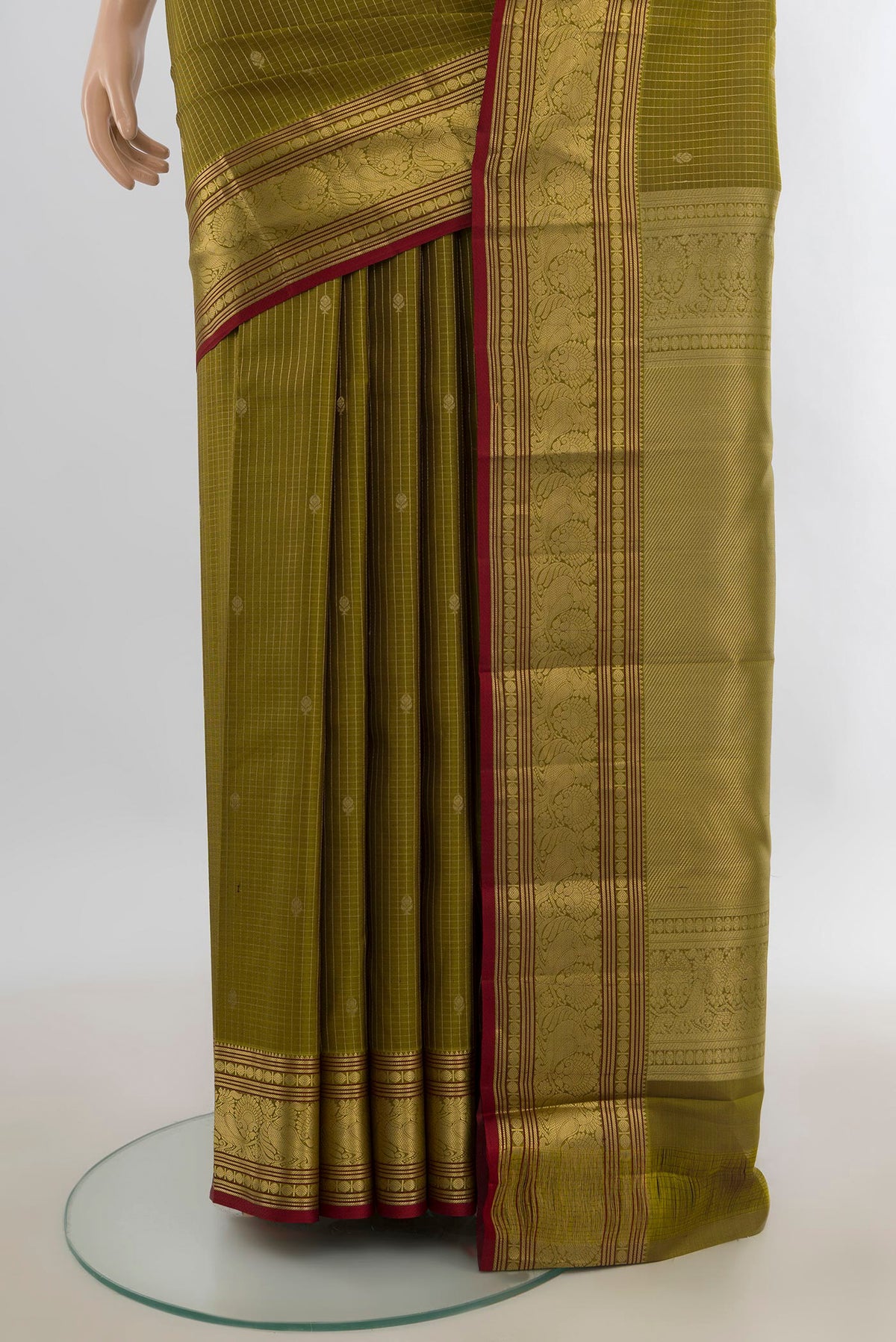 Pleats and pallu of Pure Silk Mehandi Green Kanchipuram Saree with Stripes on the body and Zari Border. 