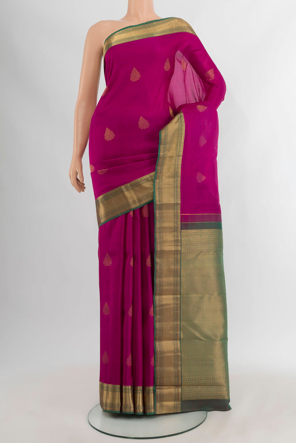 Magenta Kanchipuram Silk Saree with Zari Butta on the body and Zari Border.  displayed on a mannequin