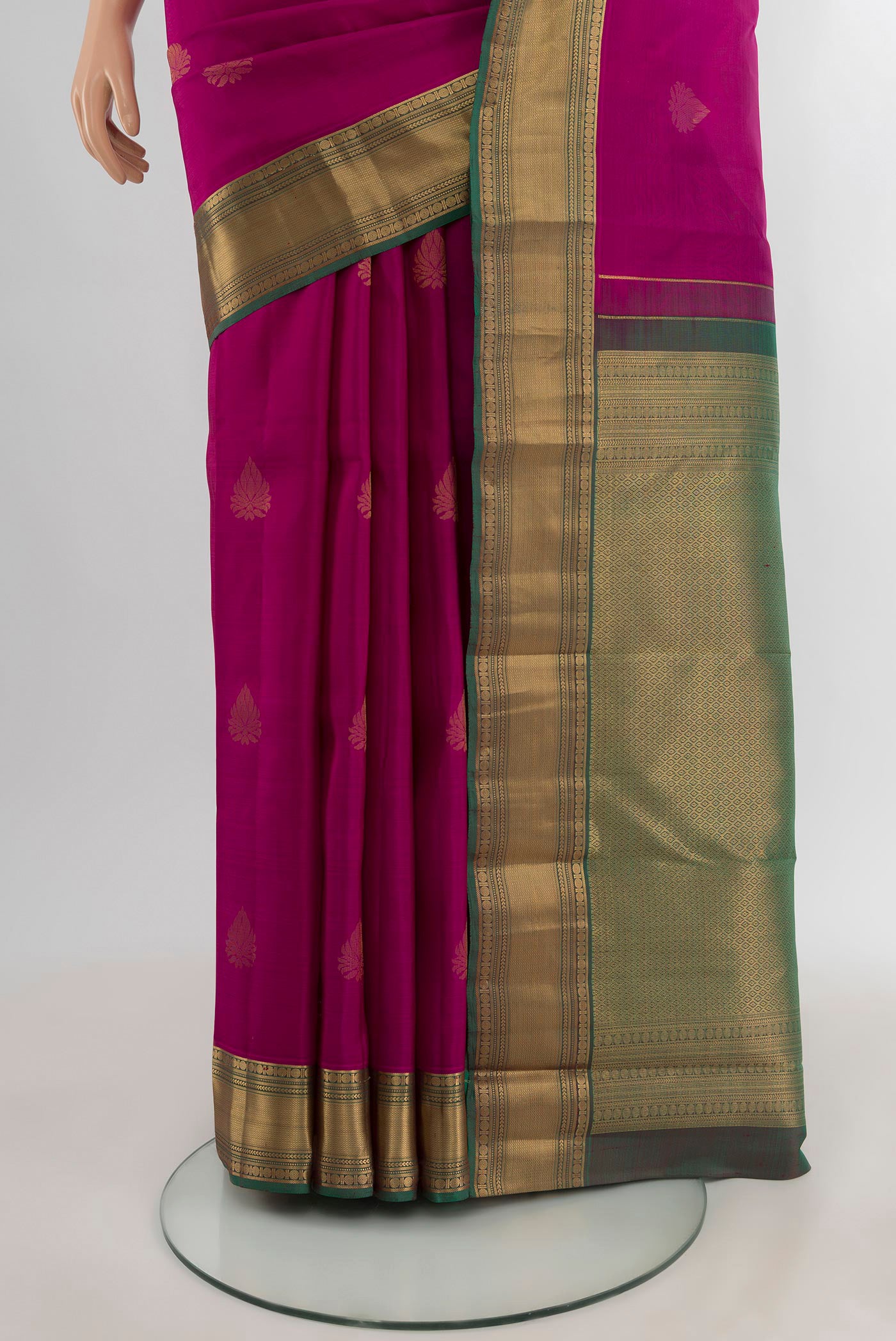 Pleats and pallu of Magenta Kanchipuram Silk Saree with Zari Butta on the body and Zari Border. 