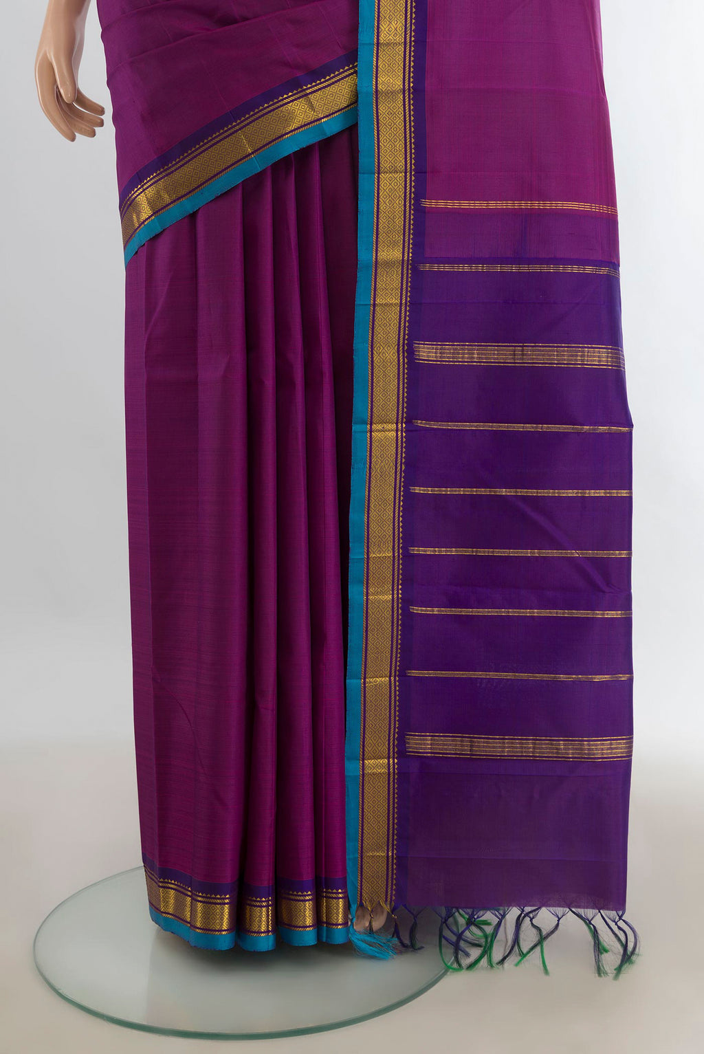 Pleats and pallu of Pure Silk Purple Kanjivaram Saree with Zari Butta on the body and Silk Border. 