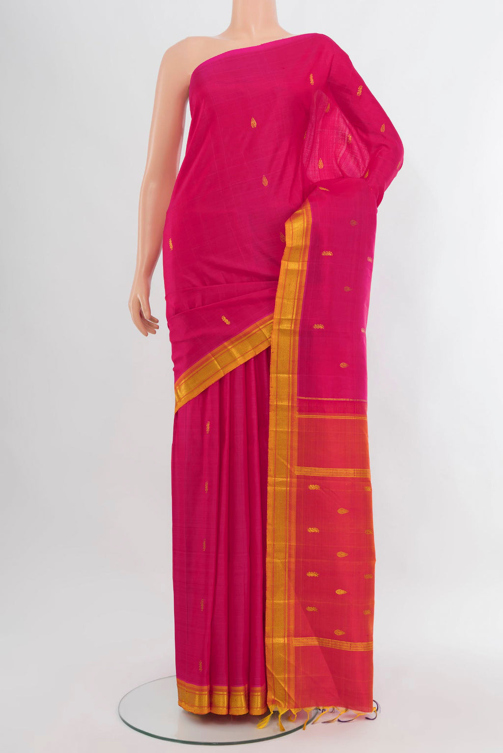 Pink Kanjivaram Silk Saree with Zari Butta on the body and One Side Border.  displayed on a mannequin