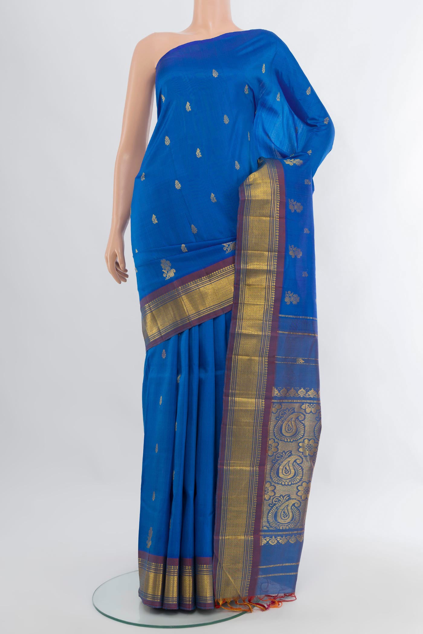 Royal Blue Kanchipuram Silk Saree with Zari Butta on the body and One Side Border.  displayed on a mannequin