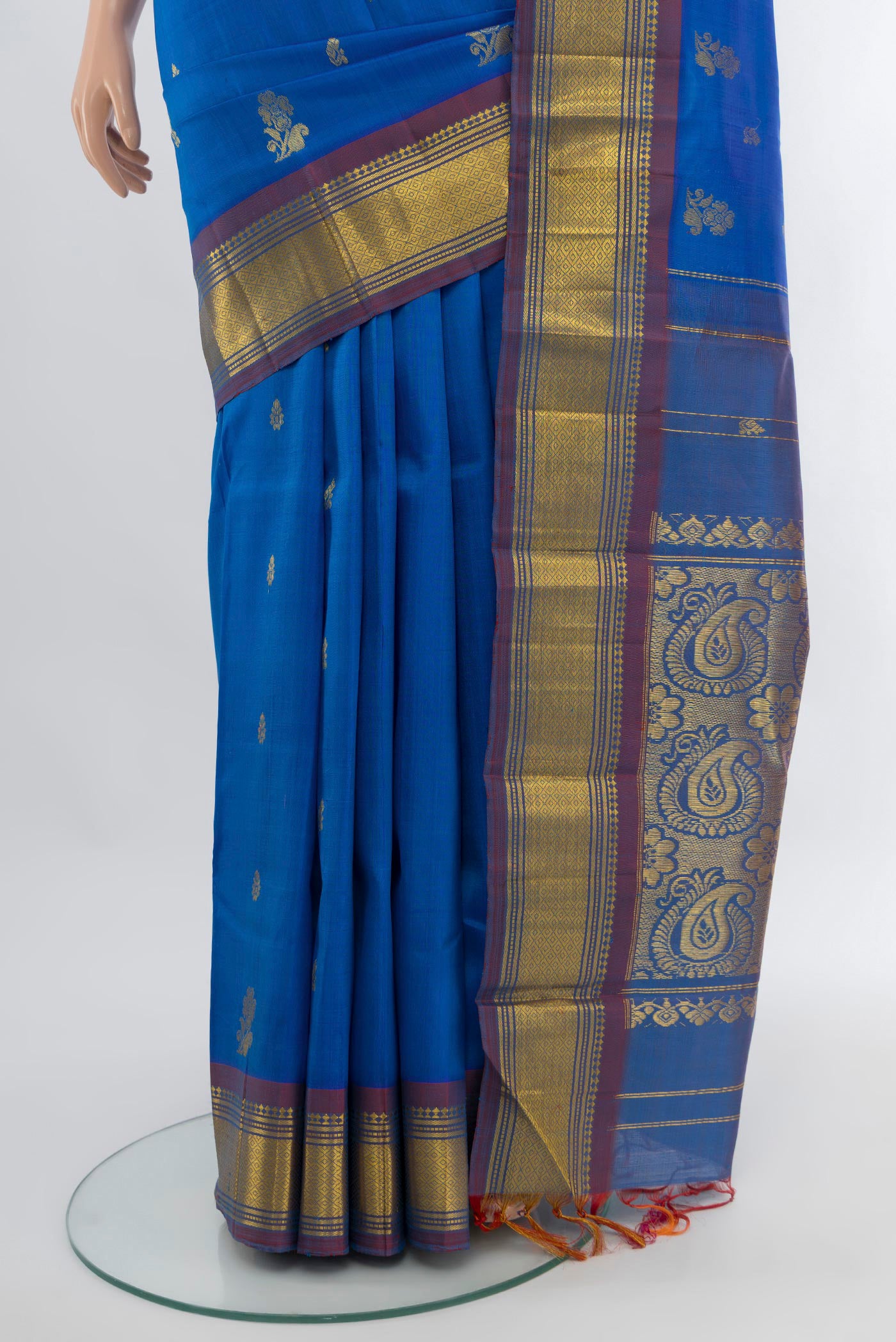 Pleats and pallu of Royal Blue Kanchipuram Silk Saree with Zari Butta on the body and One Side Border. 