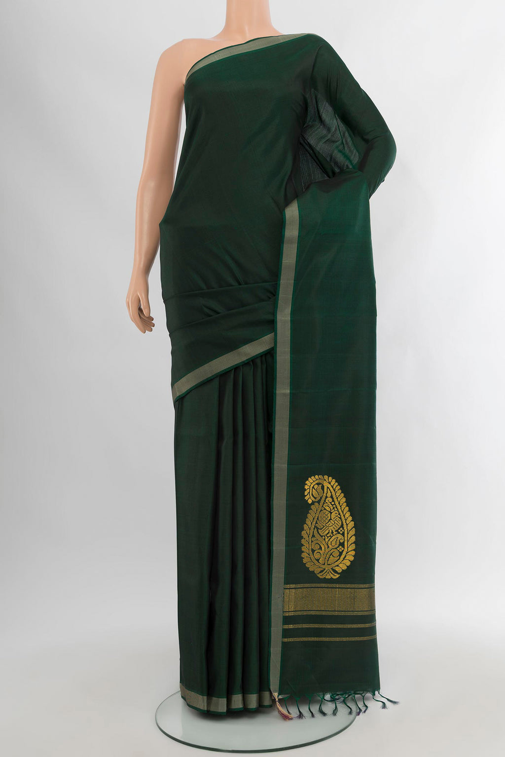 Bottle Green Kanchipuram Silk Saree with Plain Body and Thread Border.  displayed on a mannequin