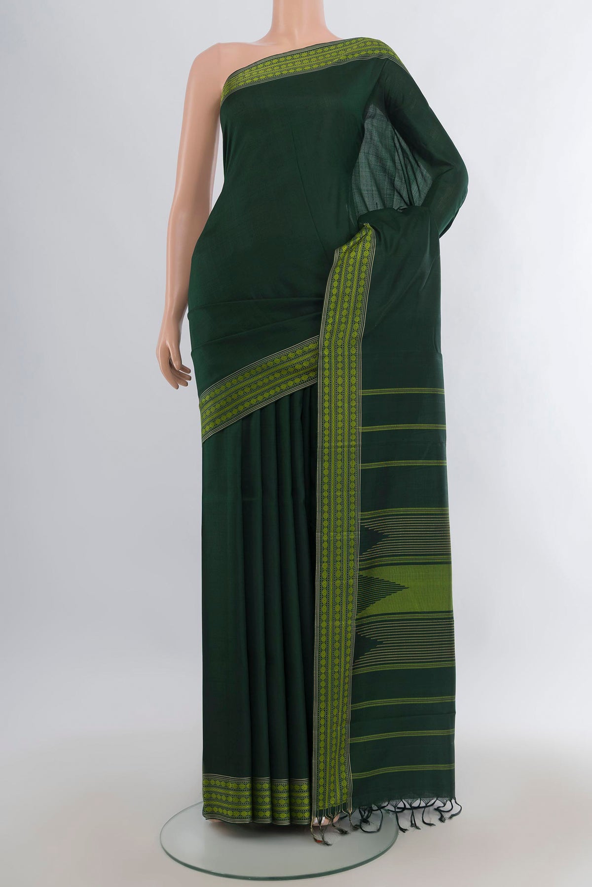 Pure Silk Bottle Green Kanchipuram Saree with Plain Body and Thread Border.  displayed on a mannequin