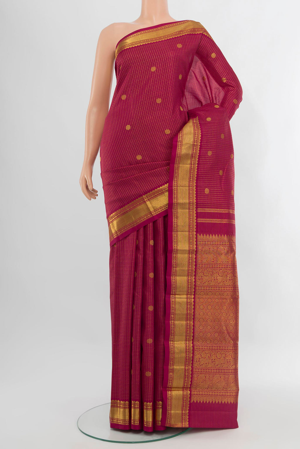Maroon Kanchipuram Silk Saree with Checked design on the body and Zari Border.  displayed on a mannequin