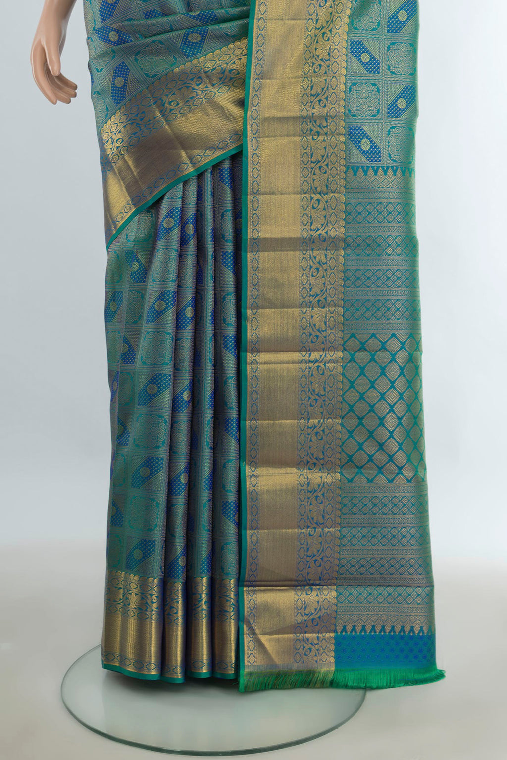 Pleats and pallu of Pure Silk Pure Zari Multi Color Kanchipuram Saree with Zari Butta on the body and Silk Border. 