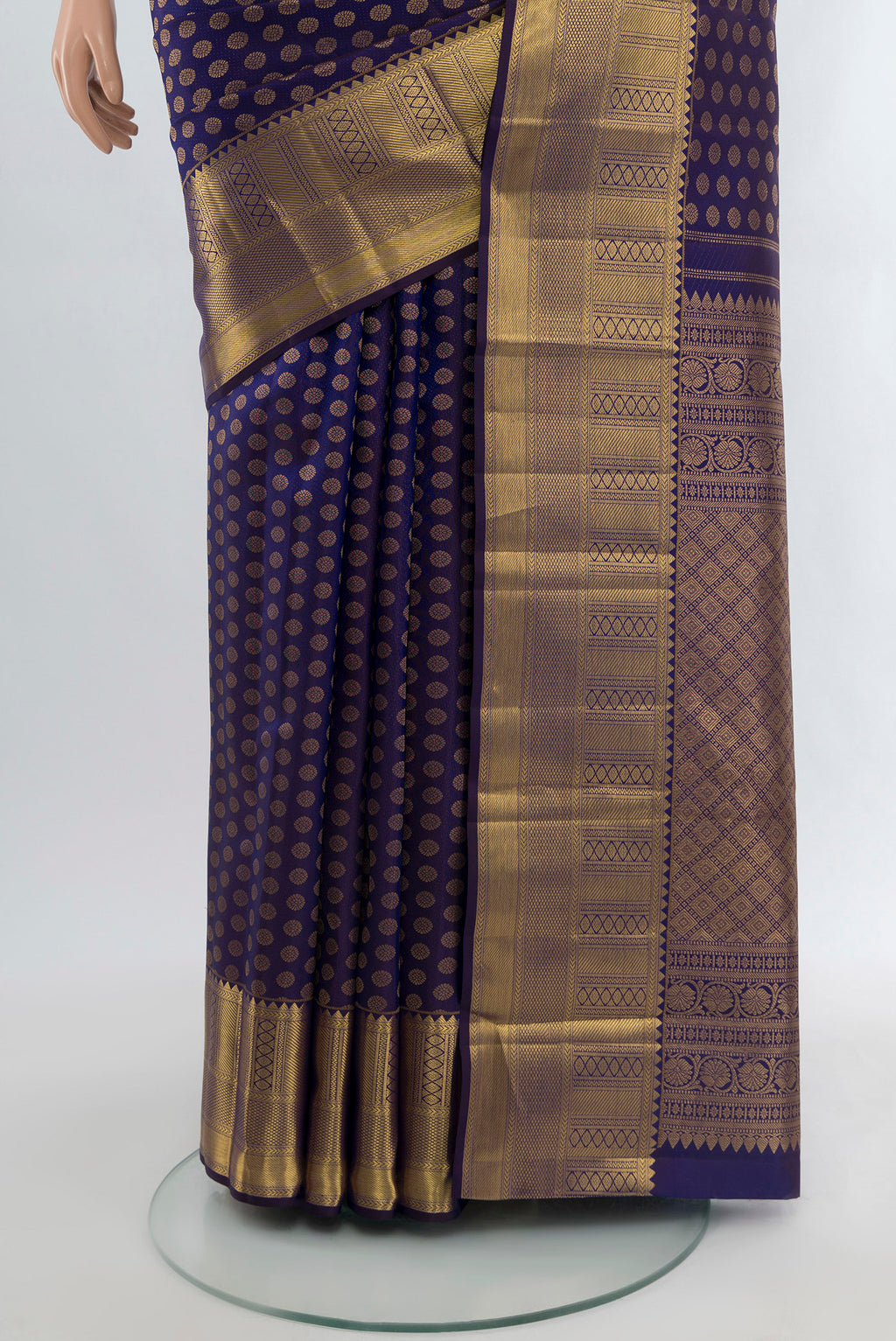 Pleats and pallu of Navy Blue Kanchipuram Silk Saree with Zari Butta on the body and Zari Border. 
