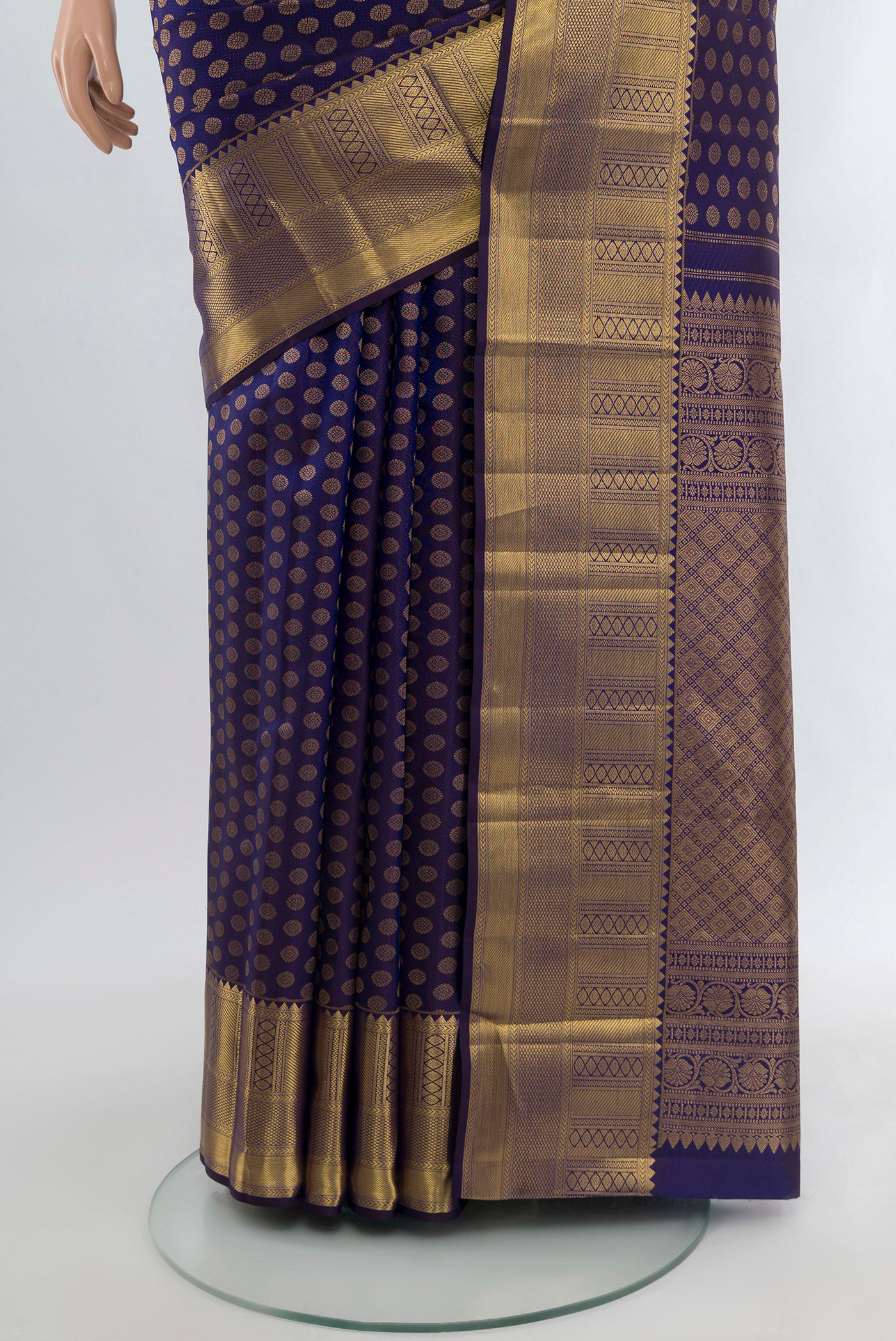 Pleats and pallu of Navy Blue Kanchipuram Silk Saree with Zari Butta on the body and Zari Border. 