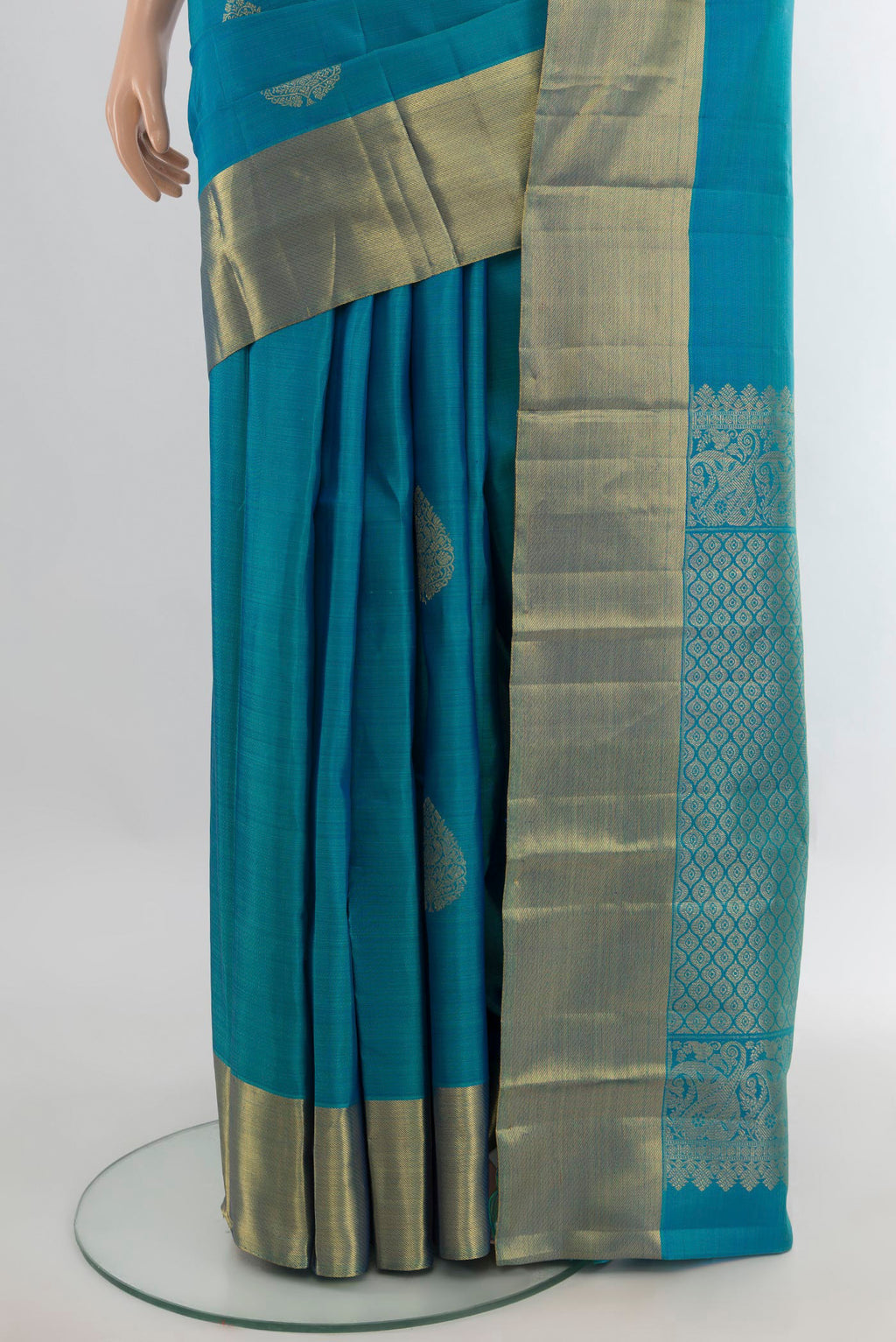 Pleats and pallu of Pure Silk Peacock Blue Kanchipuram Saree with Zari Butta on the body and Zari Border. 