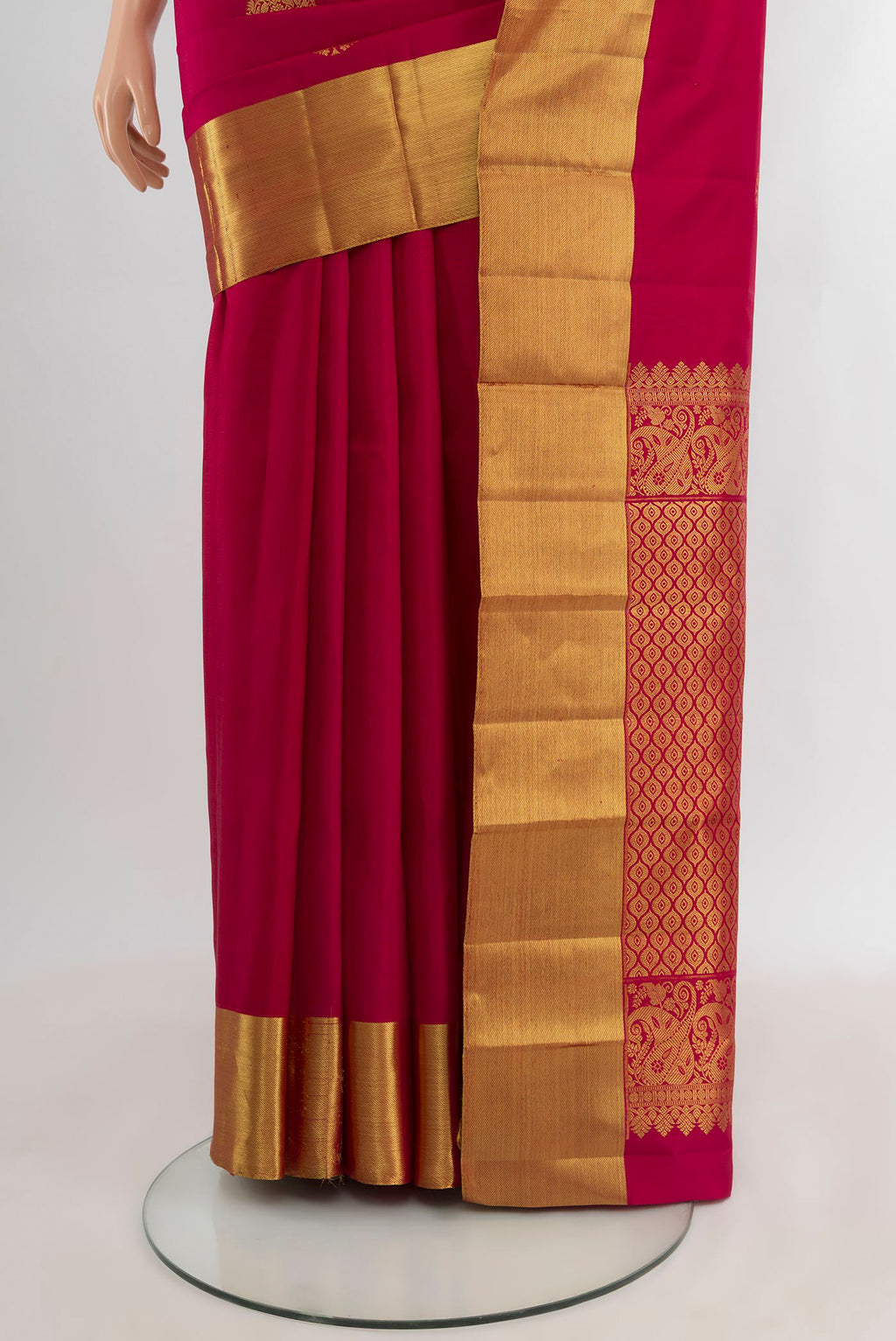 Pleats and pallu of Dark Pink Kanchipuram Silk Saree with Zari Butta on the body and Zari Border. 