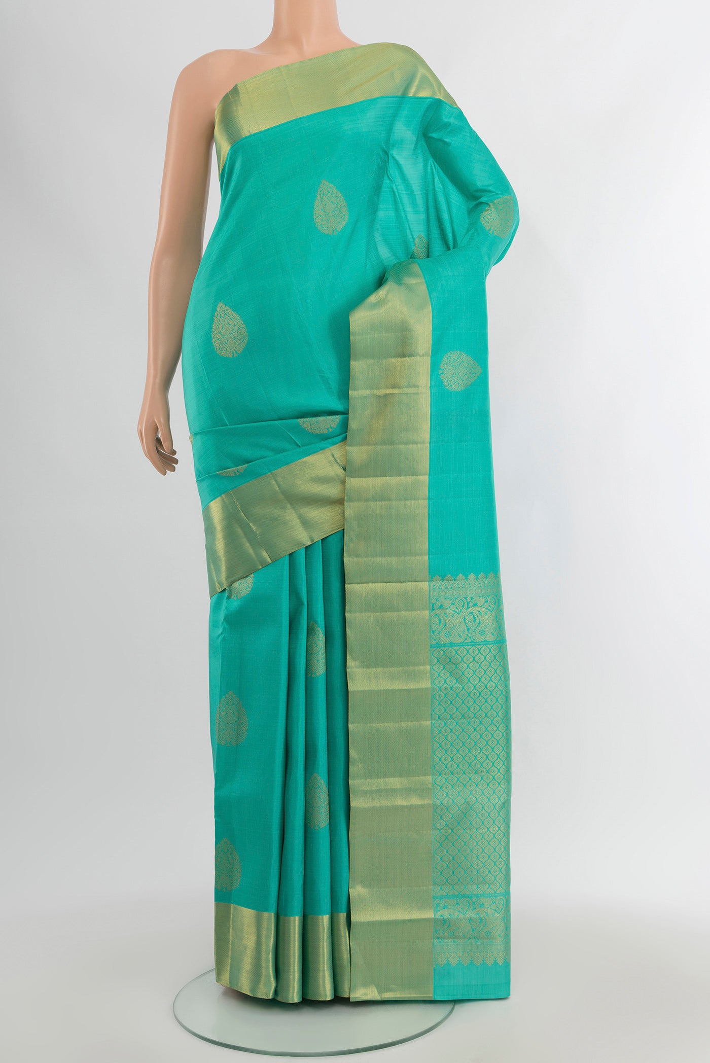 Sky Blue Kanchipuram Silk Saree with Zari Butta on the body and Zari Border.  displayed on a mannequin