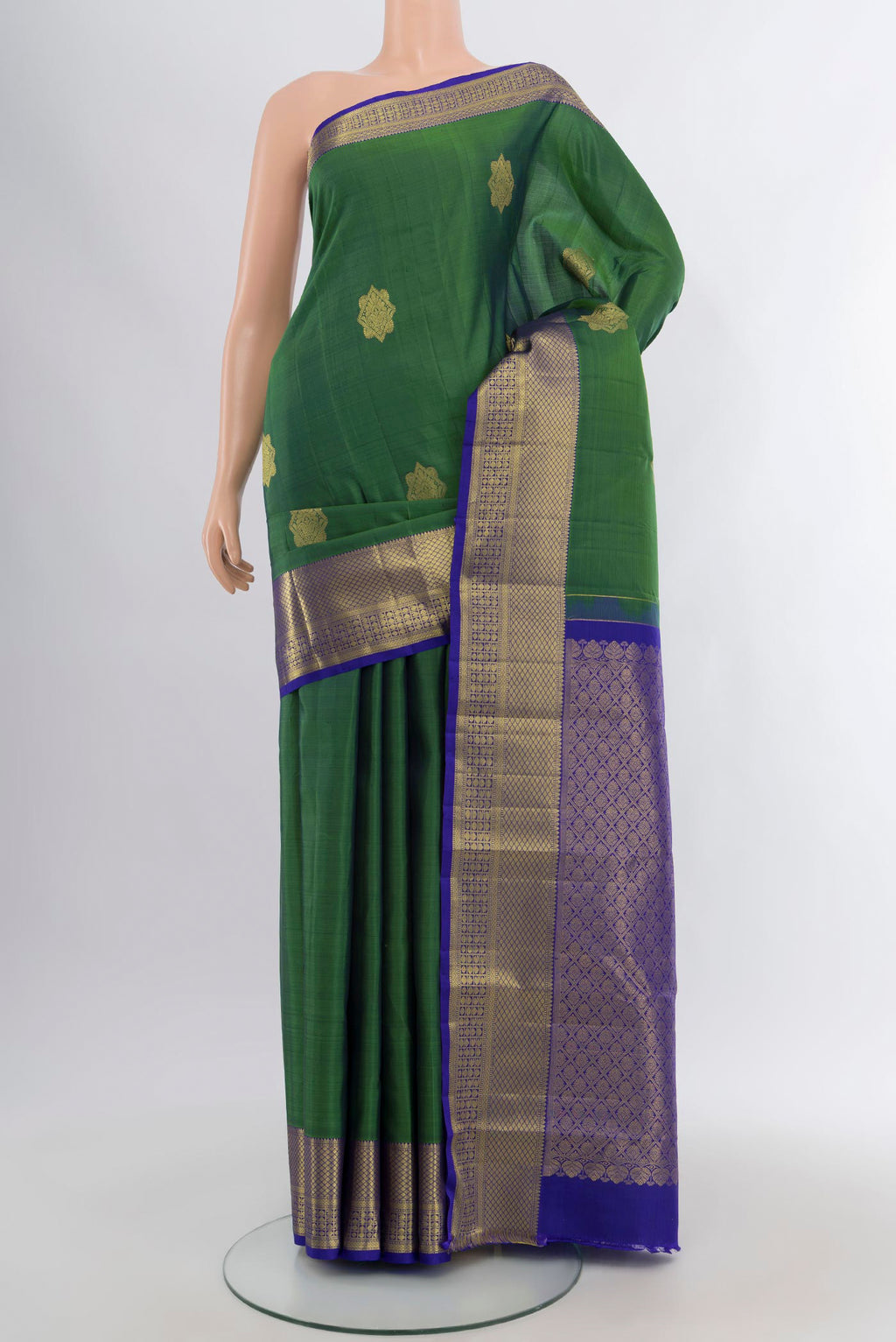 Green Dual Tone Kanchipuram Silk Saree with Zari Butta on the body and Zari Border.  displayed on a mannequin