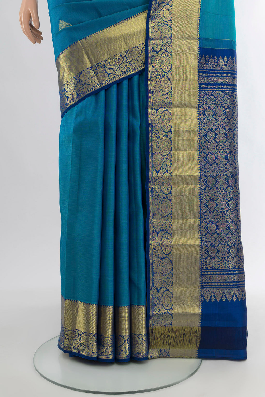 Pleats and pallu of Blue Kanchipuram Silk Saree with Zari Butta on the body and Zari Border. 