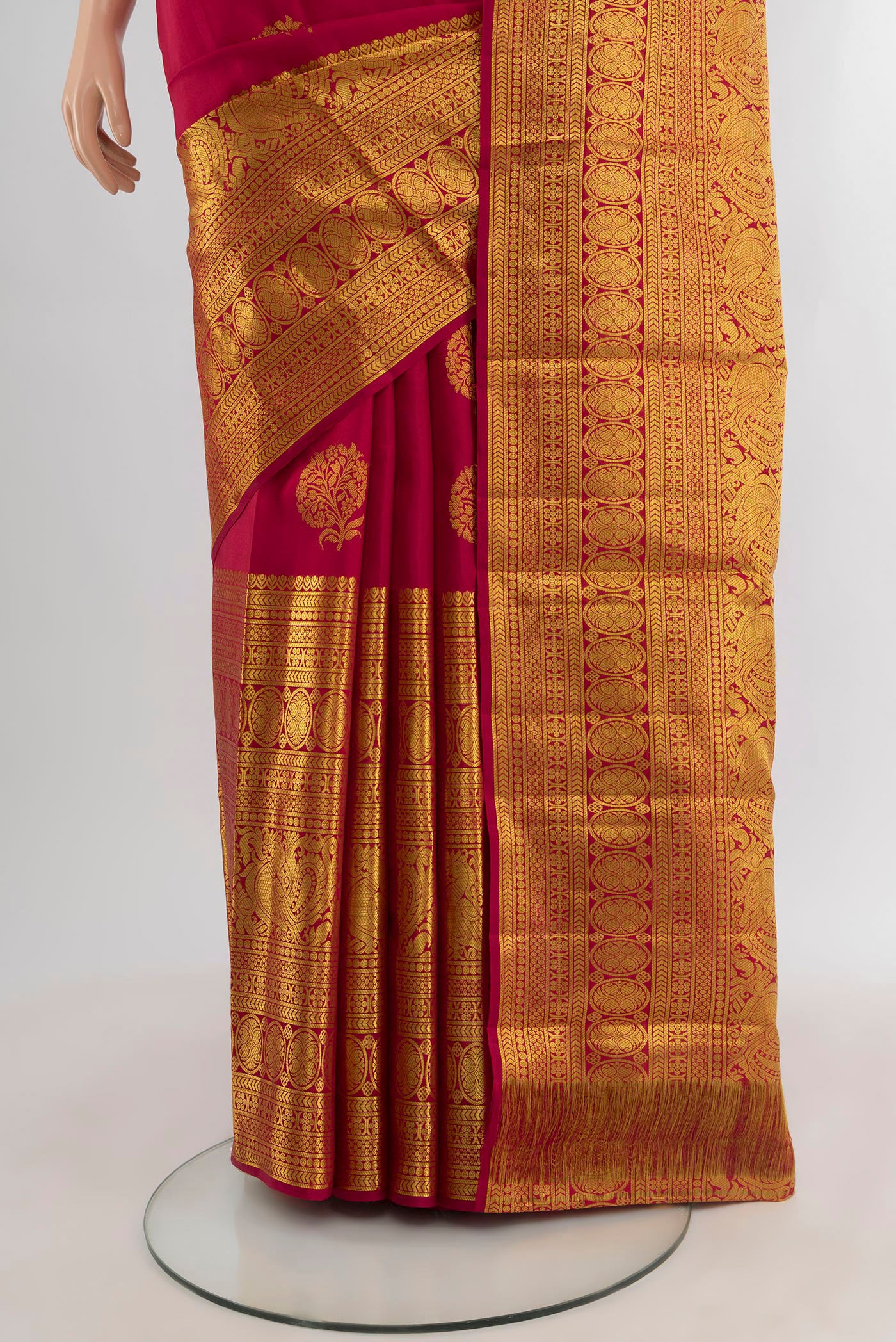 Pleats and pallu of Maroon Kanjivaram Silk Saree with Zari Butta on the body and Zari Border. 