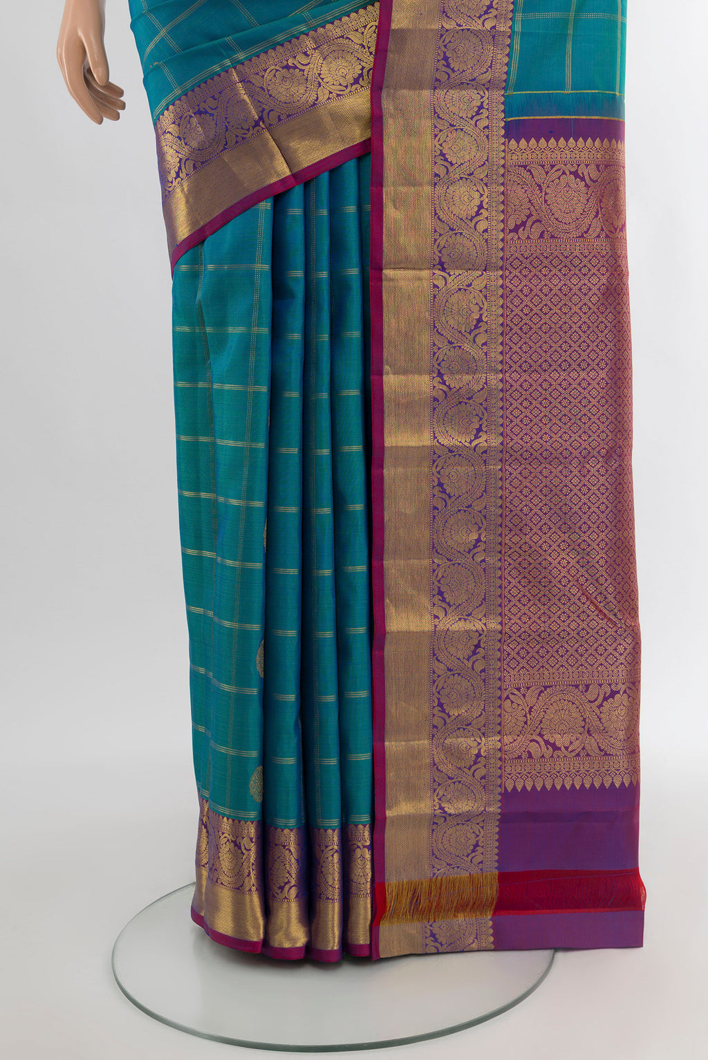 Pleats and pallu of Peacock Blue Kanchipuram Silk Saree with Checked design on the body and Zari Border. 