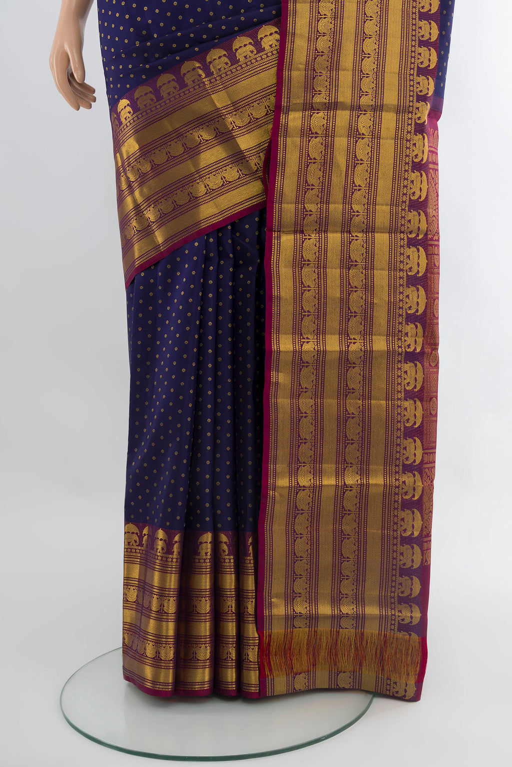 Pleats and pallu of Navy Blue Kanchipuram Silk Saree with Zari Butta on the body and Zari Border. 