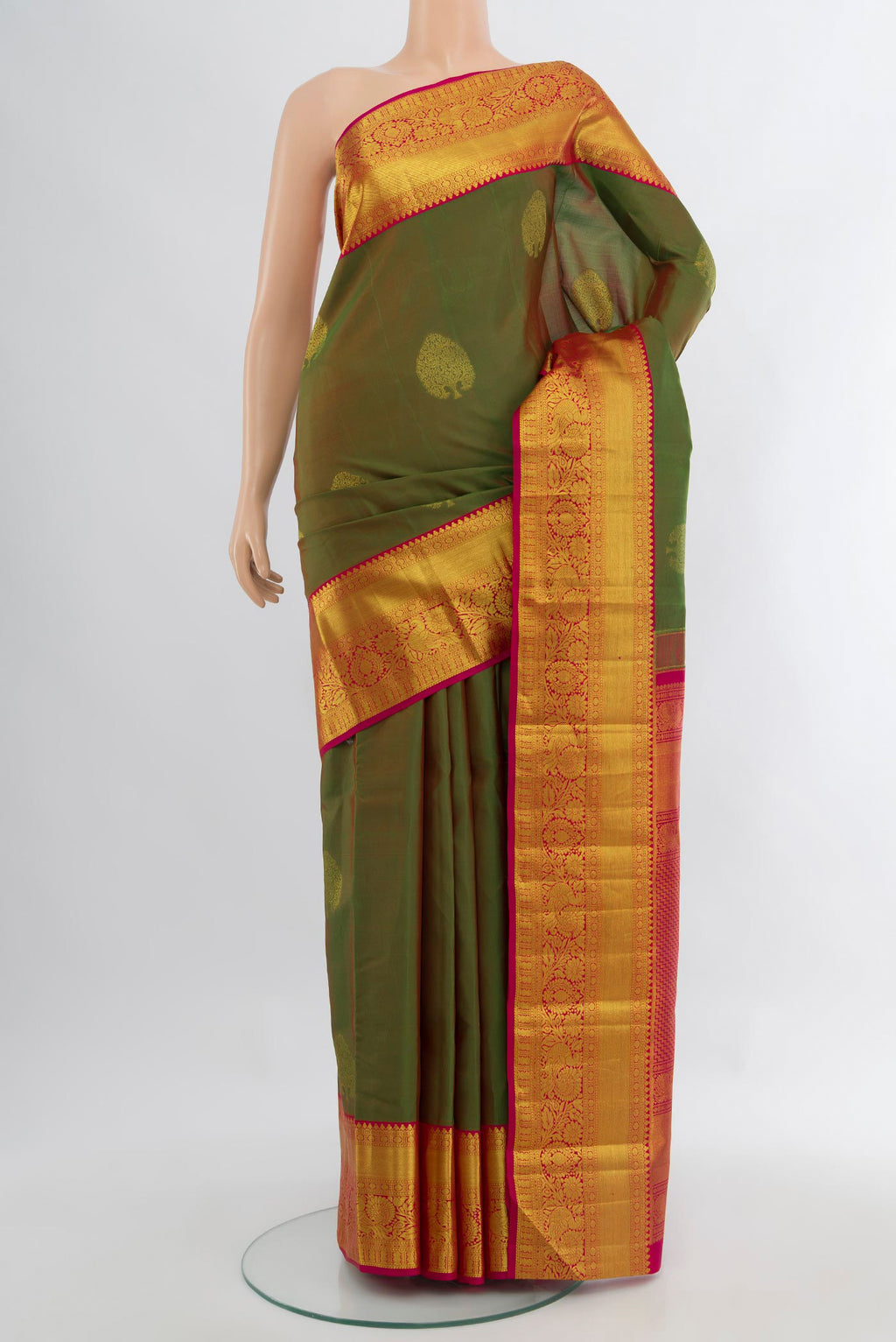 Light Green Kanchipuram Silk Saree with Zari Butta on the body and Zari Border.  displayed on a mannequin