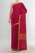 Pure Silk Pure Zari Maroon Kanjivaram Saree with Zari Butta on the body and Silk Border.  displayed on a mannequin