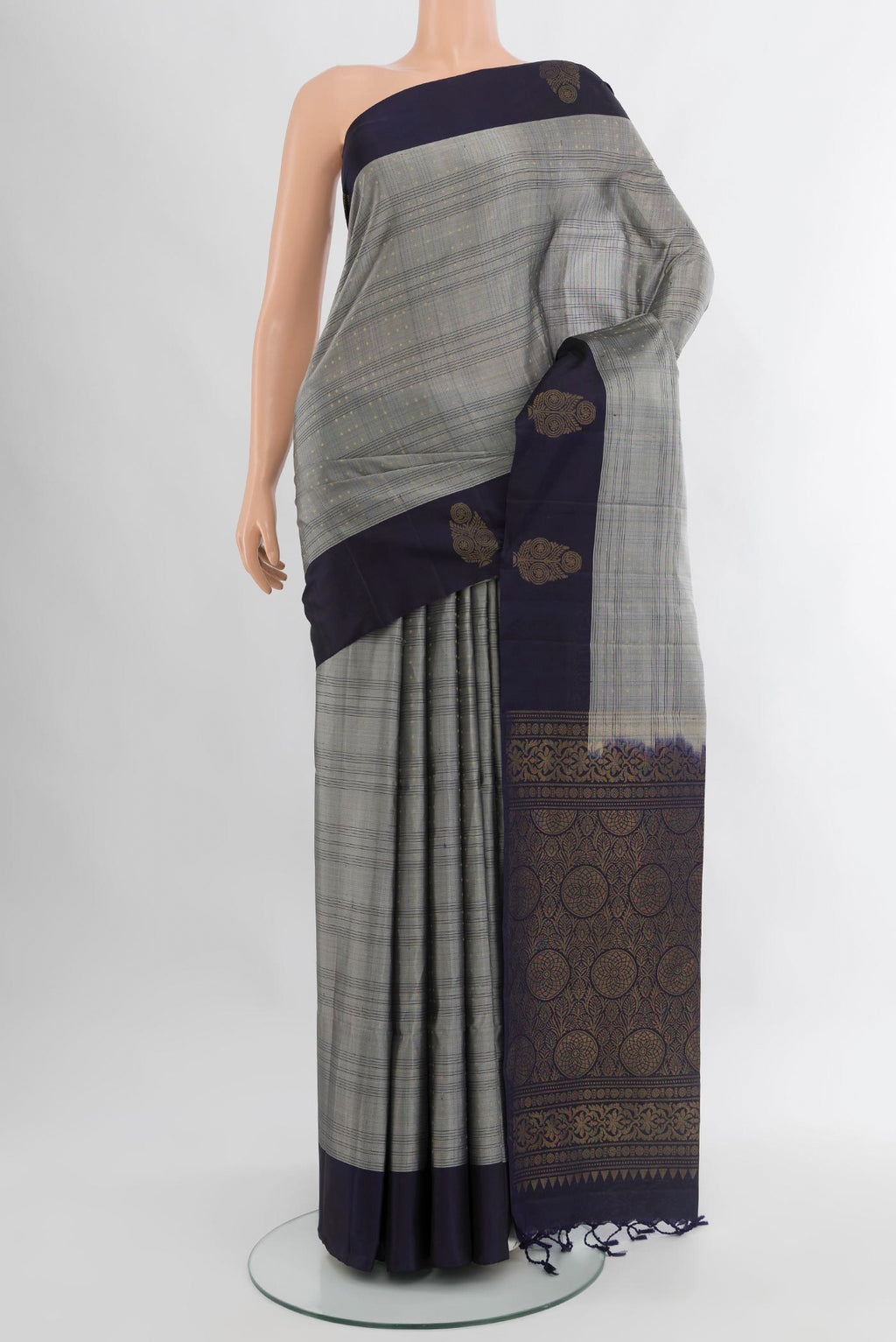 Grey Soft Silk Saree with Checked design on the body and Plain Border.  displayed on a mannequin