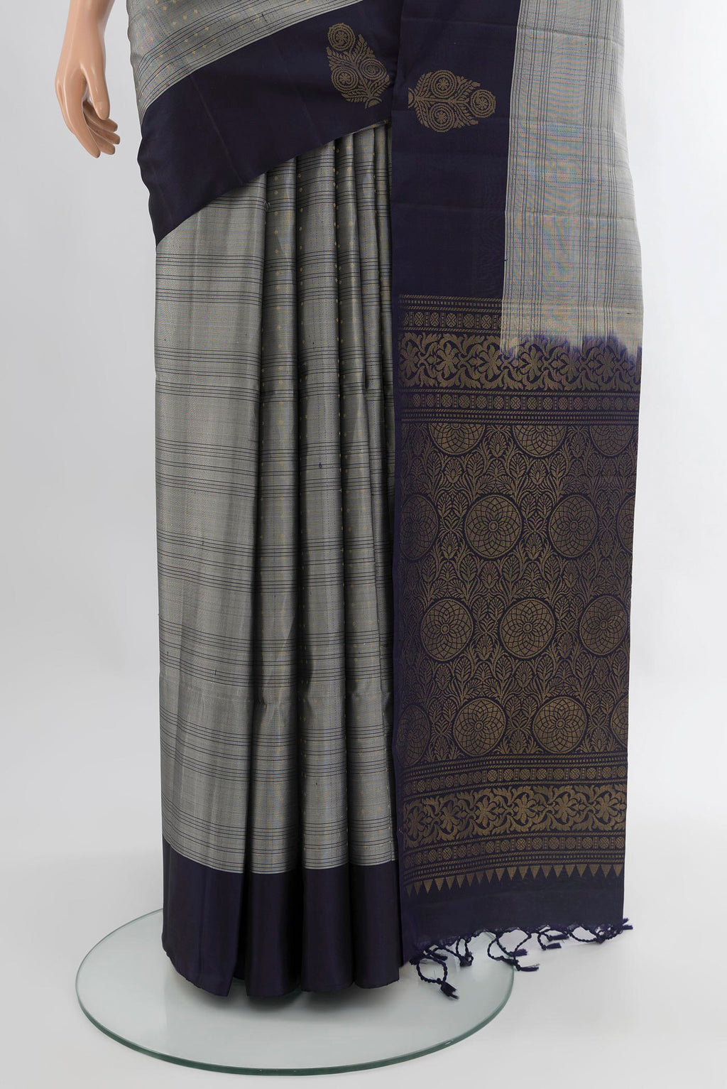 Pleats and pallu of Grey Soft Silk Saree with Checked design on the body and Plain Border. 