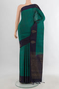 Pure Silk Teal Soft Saree with Zari Butta on the body and Plain Border.  displayed on a mannequin