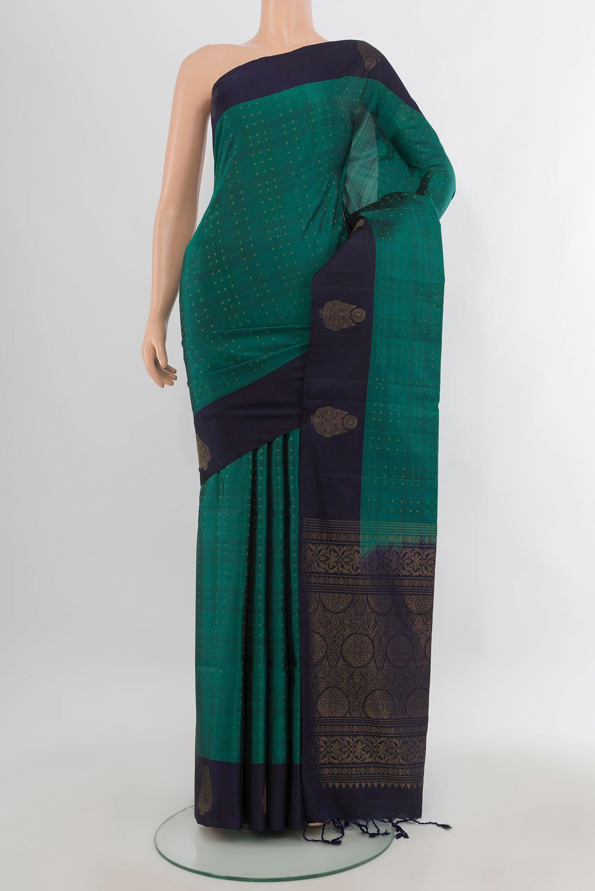 Pure Silk Teal Soft Saree with Zari Butta on the body and Plain Border.  displayed on a mannequin