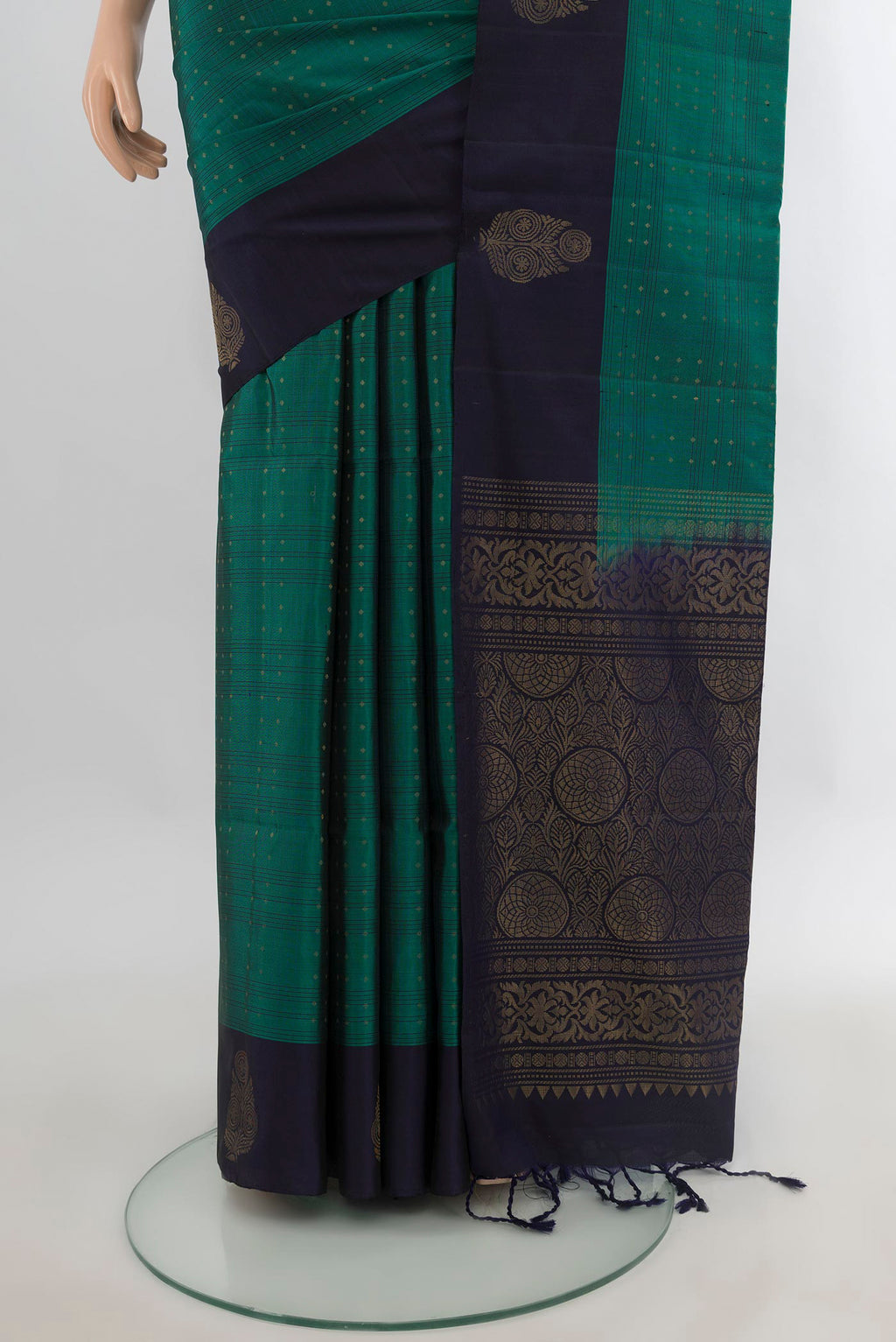 Pleats and pallu of Pure Silk Teal Soft Saree with Zari Butta on the body and Plain Border. 